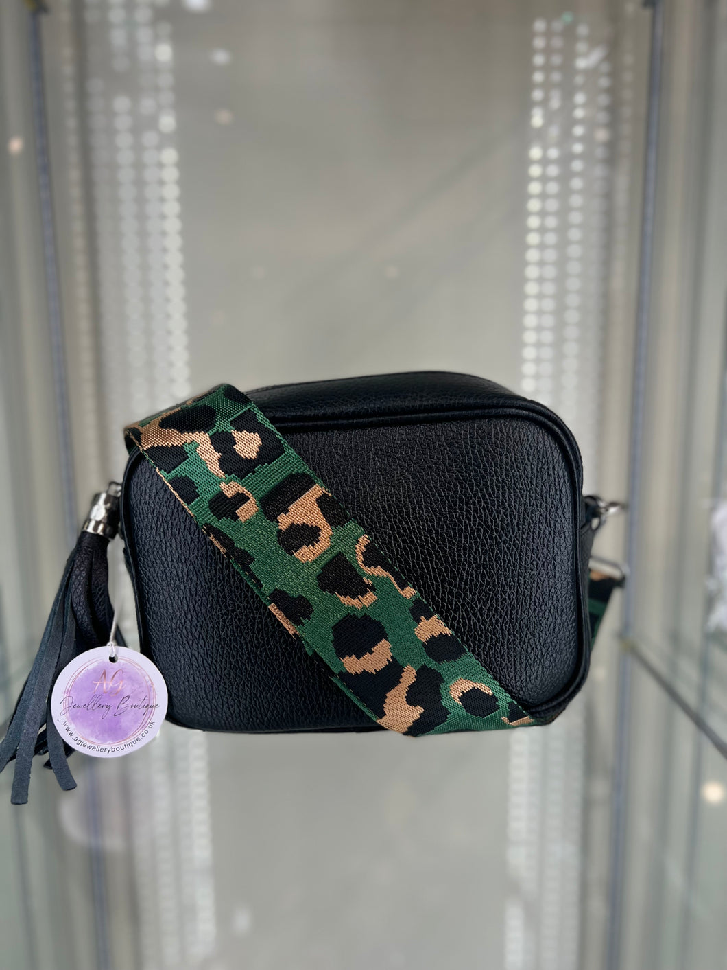 Real leather Black crossbody bag with  animal print green  strap